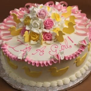 Product BB-005 is a round cake with pink and white frosting, yellow duck shapes, and icing roses on top. "It's a Girl!" is written in pink icing.