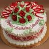 The AN-009 is a round birthday cake with white frosting, red roses, green leaves, red ribbon-like icing, and "Happy Birthday Yaroslav" written in red script on top.