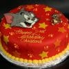 The CB-010F is a round red birthday cake with yellow stars, Tom and Jerry images, and yellow icing on the base. "Happy 2nd Birthday Christina" is written in yellow icing.
