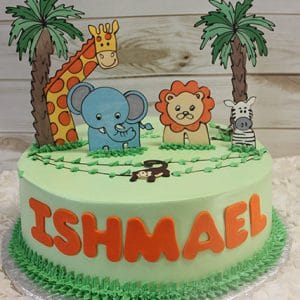 The CB-012N is a round green cake with cartoon jungle animals (giraffe, elephant, lion, zebra, monkey), palm trees, and "ISHMAEL" in large orange letters on the side.