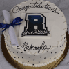 A white Randolph High School cake (GC-001E) with black polka dots, "Congratulations Makayla" in black icing, the Blue Devils logo, and a blue ribbon-tied diploma topper.
