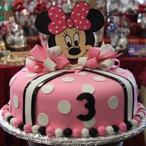 CB-001D: A pink polka dot birthday cake featuring a Minnie Mouse topper, bows, and the number 3—perfect for a child's third birthday party.