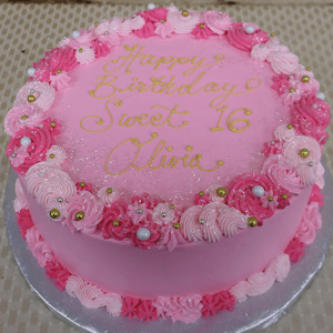 CB-018F is a round pink cake with “Happy Birthday Sweet 16 Olivia” written in yellow icing, decorated with pink and white swirls, sprinkles, and gold and white pearls.
