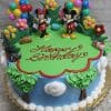 The SC-037 Mickey and Minnie cake features Mickey and Minnie toppers, colorful balloons, flower decor, green icing grass, "Happy Birthday" in red icing, blue sides with tree decorations.
