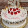 AN-002B is a round cake adorned with white icing, gold accents, red roses, and a large "50" topper. "Happy Birthday, MS!" is written in red icing on top, and the cake is presented on a gold tray.