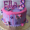 CB-024C: A purple birthday cake with pink icing drips, decorated with butterflies, flowers, “Ella,” and a large number 8 topper on a gold cake board.