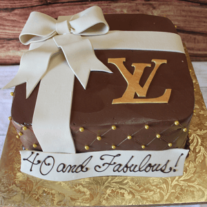 The BD-033A Designer Box Gold is a square cake styled as a brown gift box with a white fondant ribbon and bow, gold LV logo, gold dots, and a "40 and Fabulous!" banner on a gold-patterned board.