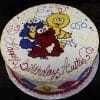CB-003A: Round birthday cake featuring Cookie Monster, Elmo, and Big Bird from Sesame Street with colorful swirls and "Happy Birthday Austin" in red icing.