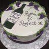 The BD-024P VintageWine cake features purple grapes and a wine bottle design, with the message "Aged to Perfection" and "Vintage Edward 1971," presented on a silver board.