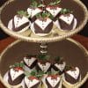 ST-002 Tuxedo Strawberries, decorated like tiny tuxedos, are elegantly arranged on both tiers of a silver tray.