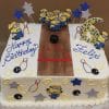 CB-013A: Rectangular birthday cake featuring a bowling alley design with Minion decorations, “Happy Birthday Felix,” a large blue and yellow 6, plus bowling pins, balls, and star accents.
