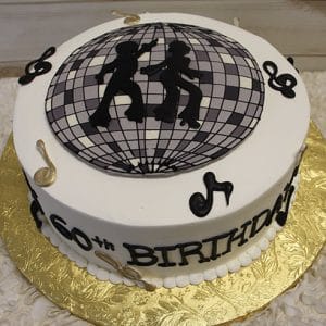 The BD-063 Disco theme/Music notes cake is round with a disco ball design on top, two dancer silhouettes, musical notes on the sides, "60th BIRTHDAY" in black letters, and set on a gold board.