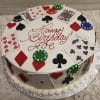 The GR-012 is a round birthday cake with playing cards, poker chips, and card suit symbols, topped with "Happy Birthday" in red icing. It sits on a silver board with piped white frosting around the edge.