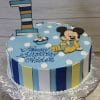 The CB-002B cake features blue and white polka dots, a striped number one, a cartoon mouse topper, a small candle, "Happy Birthday Aiden" in blue icing, and side stripes in blue, yellow, and white.