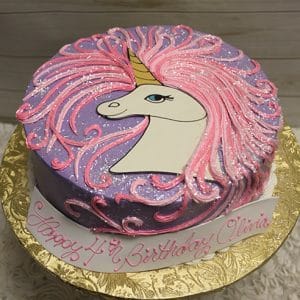 The CB-021A is a round birthday cake with a purple and pink unicorn design, flowing pink mane, gold horn, on a gold tray. "Happy 4th Birthday Olivia" is written on a white ribbon.