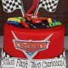 Cars-themed birthday cake with decorations